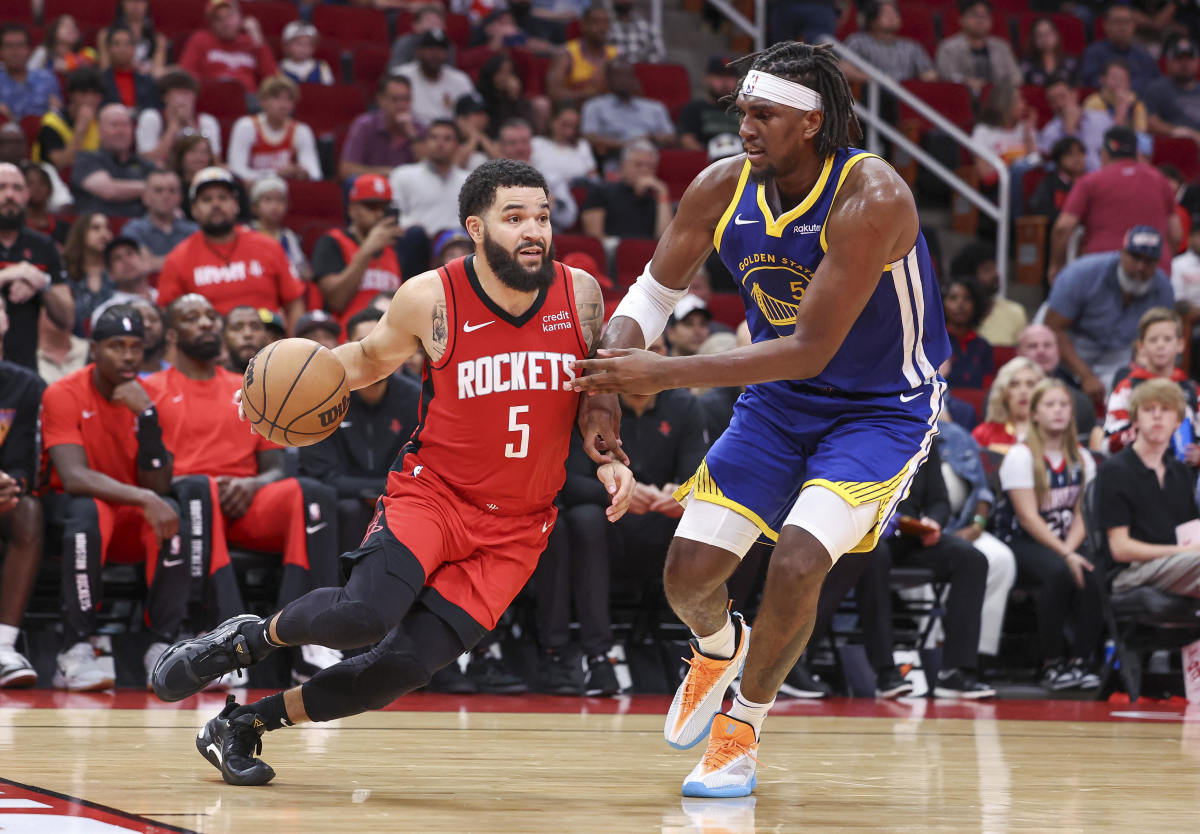 Houston Rockets guard Fred VanVleet (5) drives past Golden State Warriors center Kevon Looney (5)